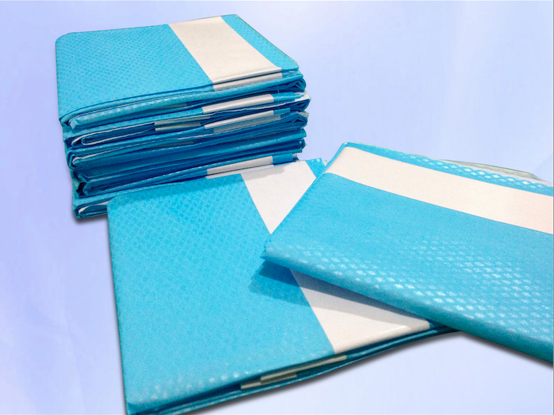 Surgical Drape with Adhesive Hole